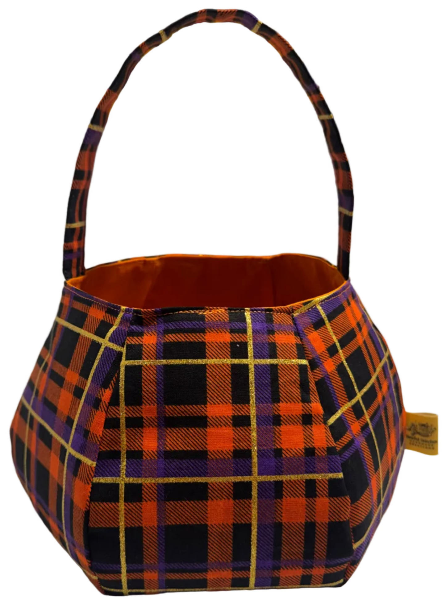 A pumpkin shaped handbag with a plaid pattern in orange, black, and purple, featuring a single top handle